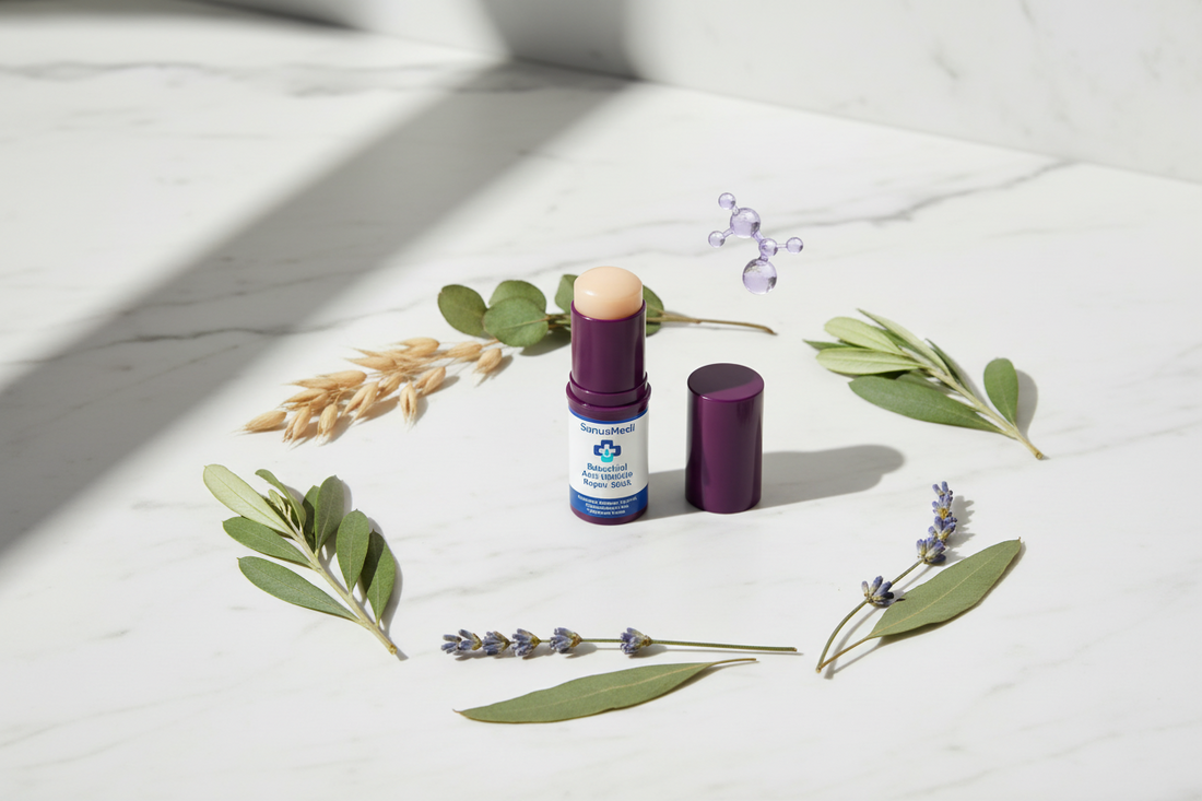 SanusMedi Bakuchiol Anti-Wrinkle Repair Stick surrounded by botanical ingredients on a white marble surface